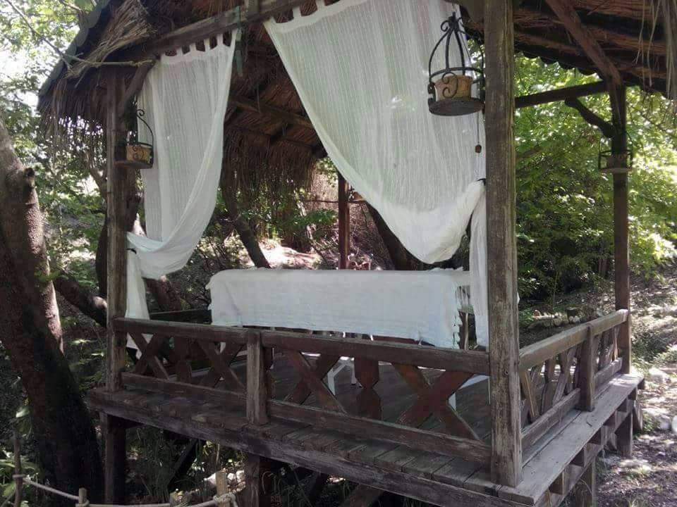 Practice your yoga, book a massage or just relax on the chill out platform by the waterfall. Courtesy of NaturalSpringsRetreat.com