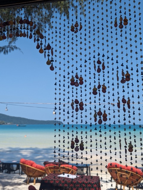 Beaded vurtain on beach in Cambidoa sea views